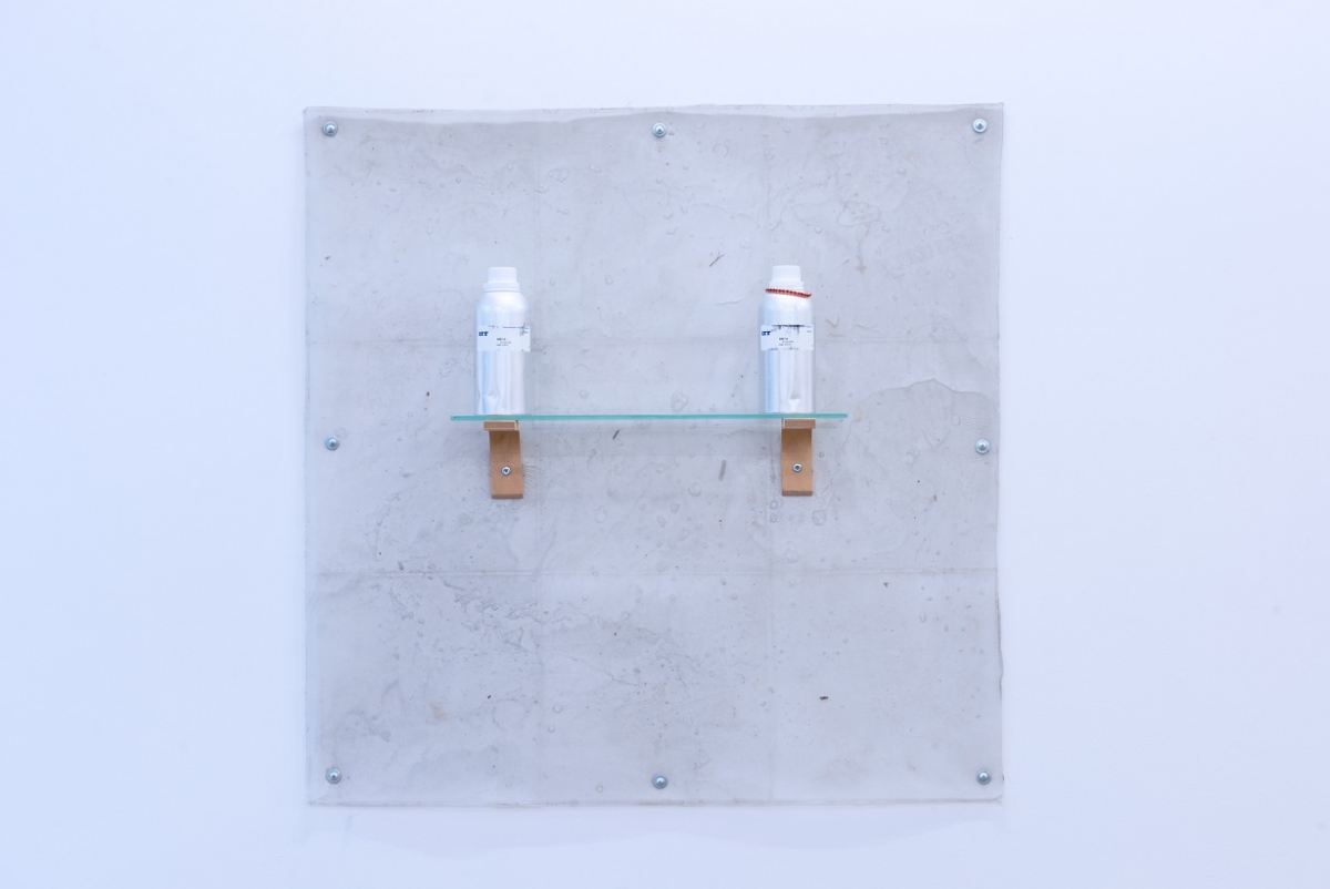 Dorota Gawęda and Eglė Kulbokaitė, Being fogs and clouds, 2017, clear glycerine soap base, natural black clay, ash, shelf, screws, found object, fragrance BODY AI (III) and (IV) (produced with support of IFF Inc.; in collaboration with Caroline Dumur), aluminum bottle with label (edition of 10). Photo: Arnas Anskaitis