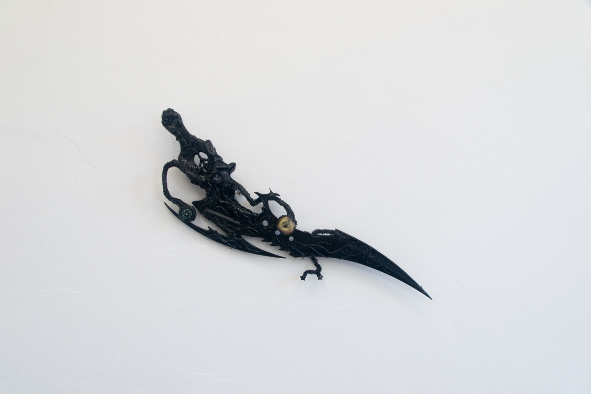 Perrin Turner Model 2, 2018 Resin, fly, dyed cotton, magnetic field, pipe cleaners, beads, thorns, comb, blade, and paint 5 x 19 x 1/2 inches