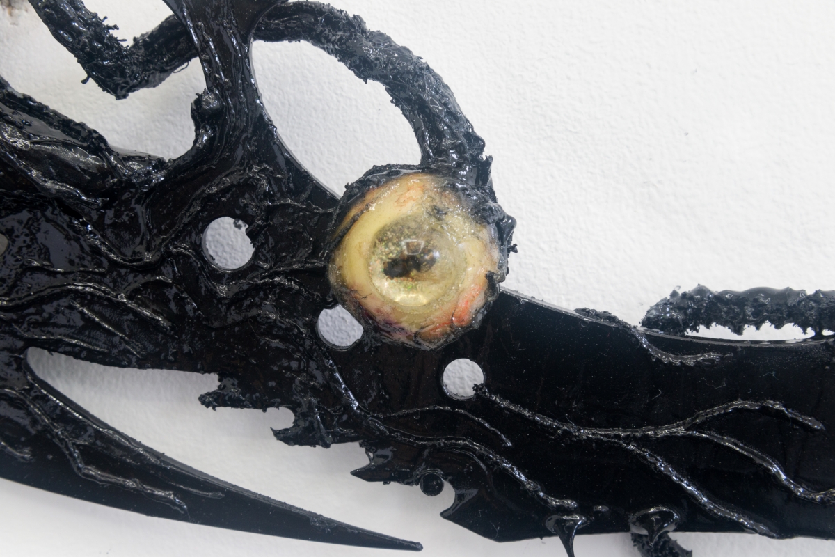 Perrin Turner Model 2, 2018 Resin, fly, dyed cotton, magnetic field, pipe cleaners, beads, thorns, comb, blade, and paint 5 x 19 x 1/2 inches