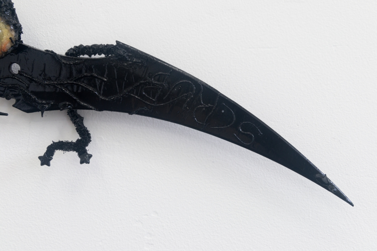 Perrin Turner Model 2, 2018 Resin, fly, dyed cotton, magnetic field, pipe cleaners, beads, thorns, comb, blade, and paint 5 x 19 x 1/2 inches