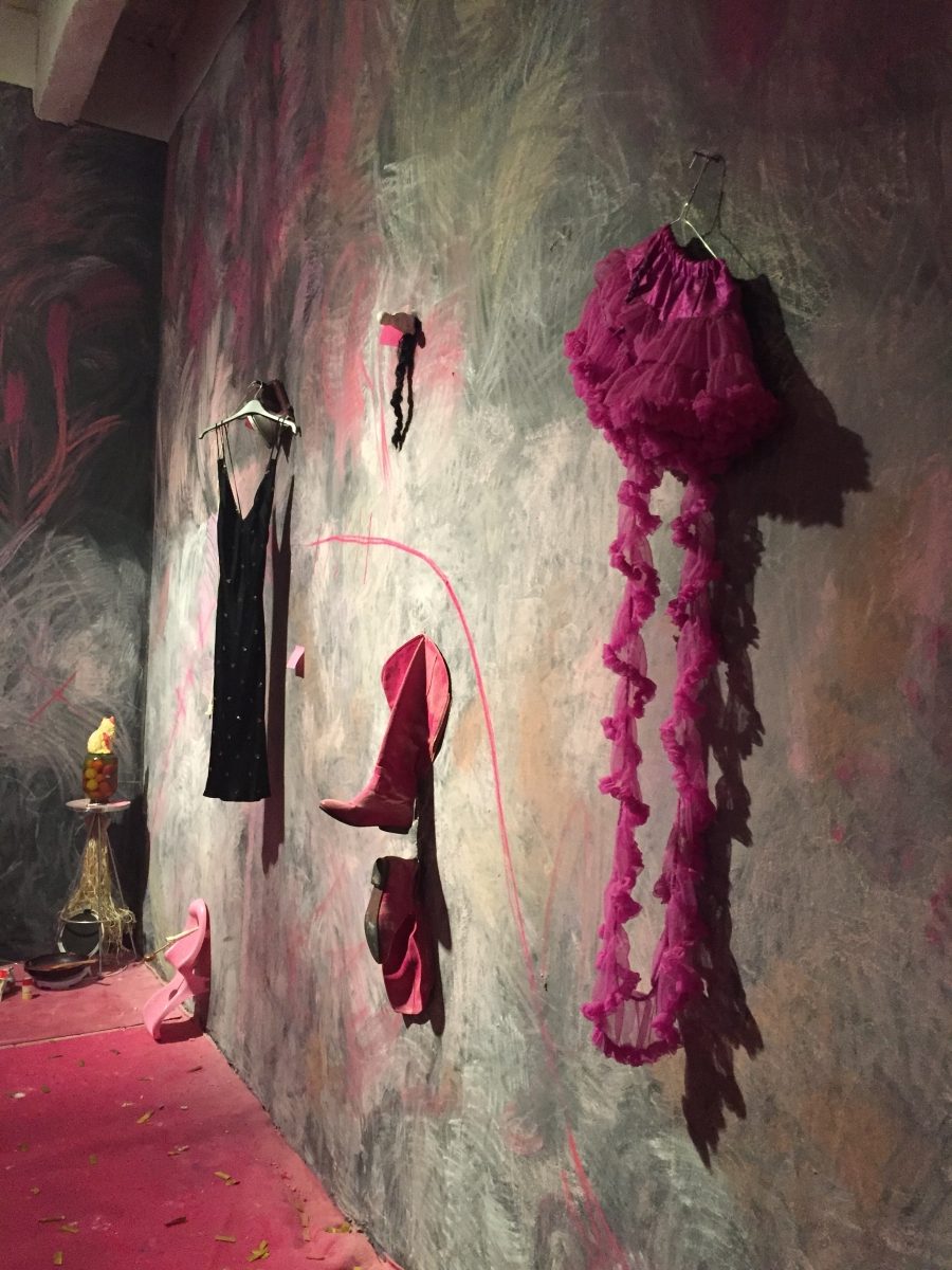 Installation with pink boots that belonged to Anna-Stina Treumund. According to Killu Sukmit they mark the footprint of the artist, and transmit the idea of being on the way, making one's mark, and kicking the door open.